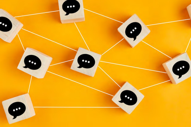 Image shows wooden blocks with speech bubble icons, connected to each other by string on a yellow background.