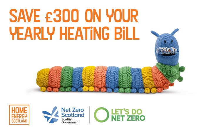 A multicoloured knitted caterpillar draught excluder with orange text above saying 'Save £300 on your yearly heating bill'.