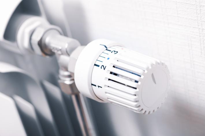 A close up shot of a radiator temperature guage