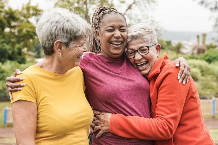 Women hugging and smiling