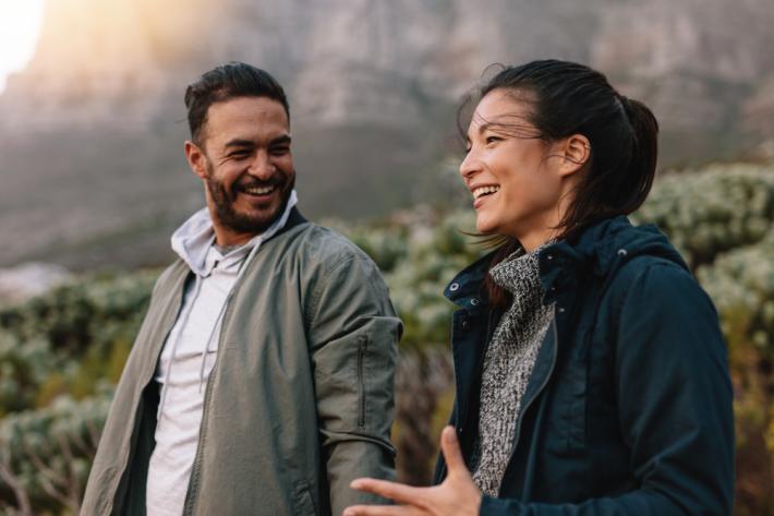 Woman and man outside talking