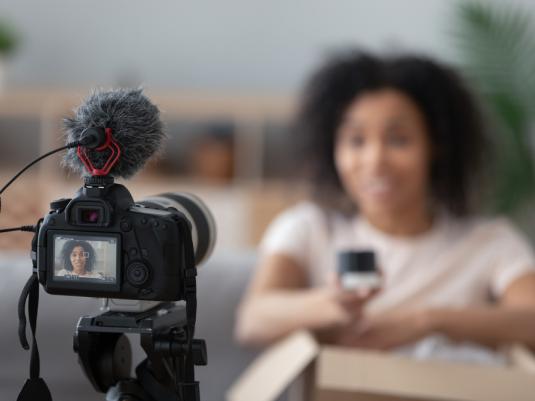 Woman recording video of herself